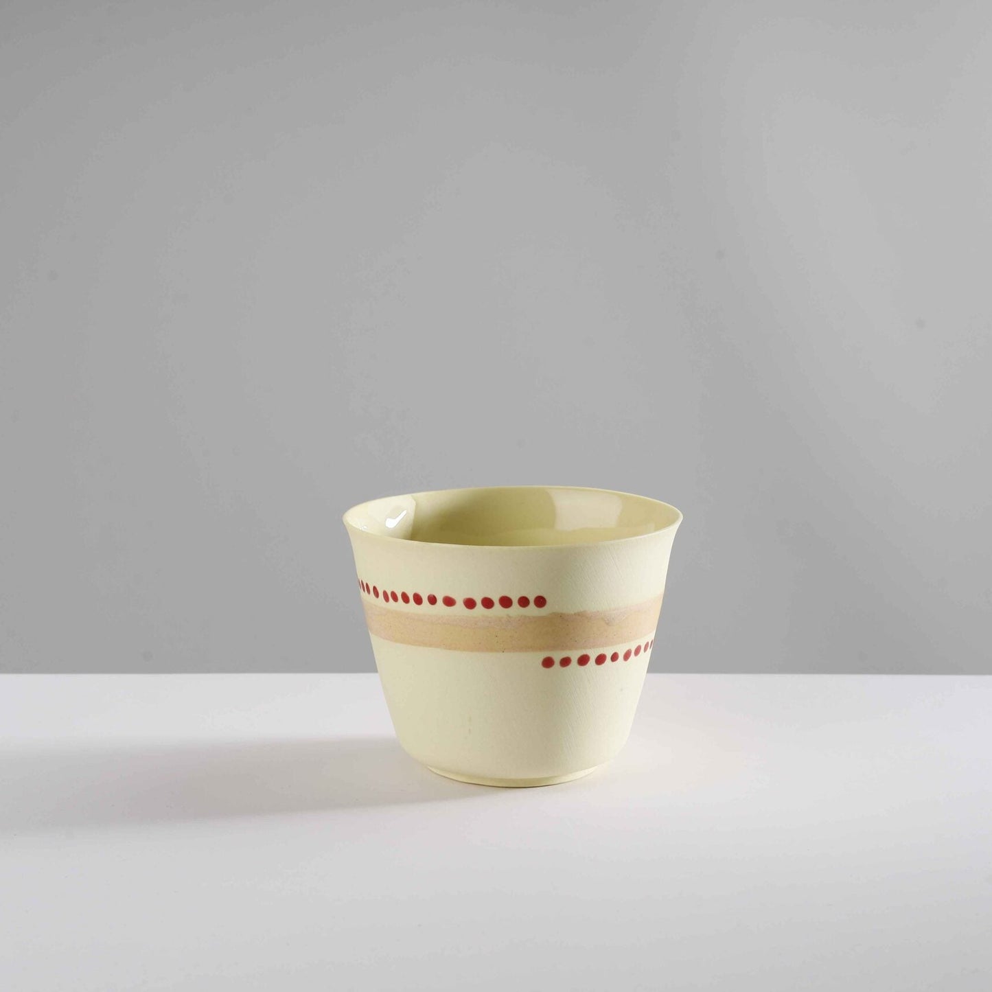 v shape - macadamia nut/red dots